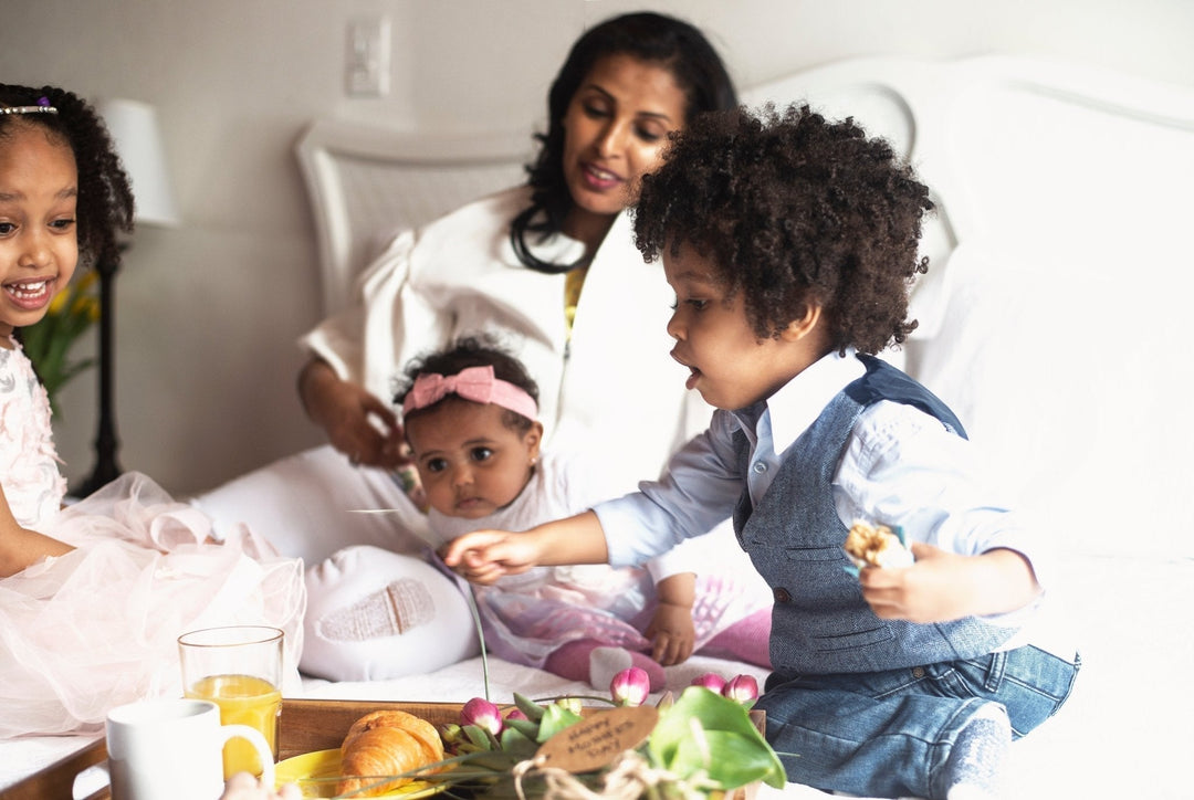 Mother with children representing simplified skincare journey by founder Marzia Rahmani